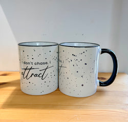 Cup with quotes-I don’t chase I attract-
