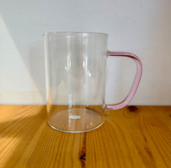 Glass cup with pink glass handler